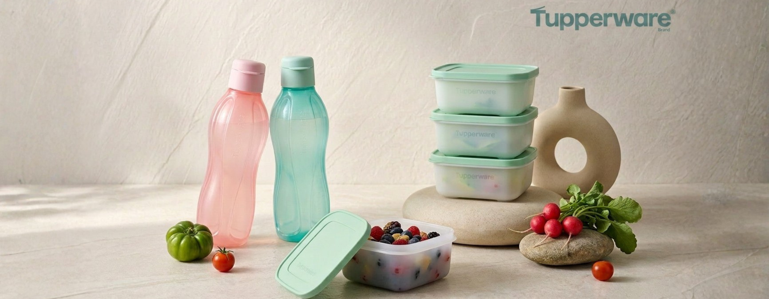 Tupperware products including containers and bottles on a neutral background with Tupperware branding.